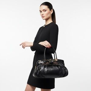 BRACCIALINI BLACK LEATHER BAG WITH FLORAL EMBELLISHMENT WOMAN